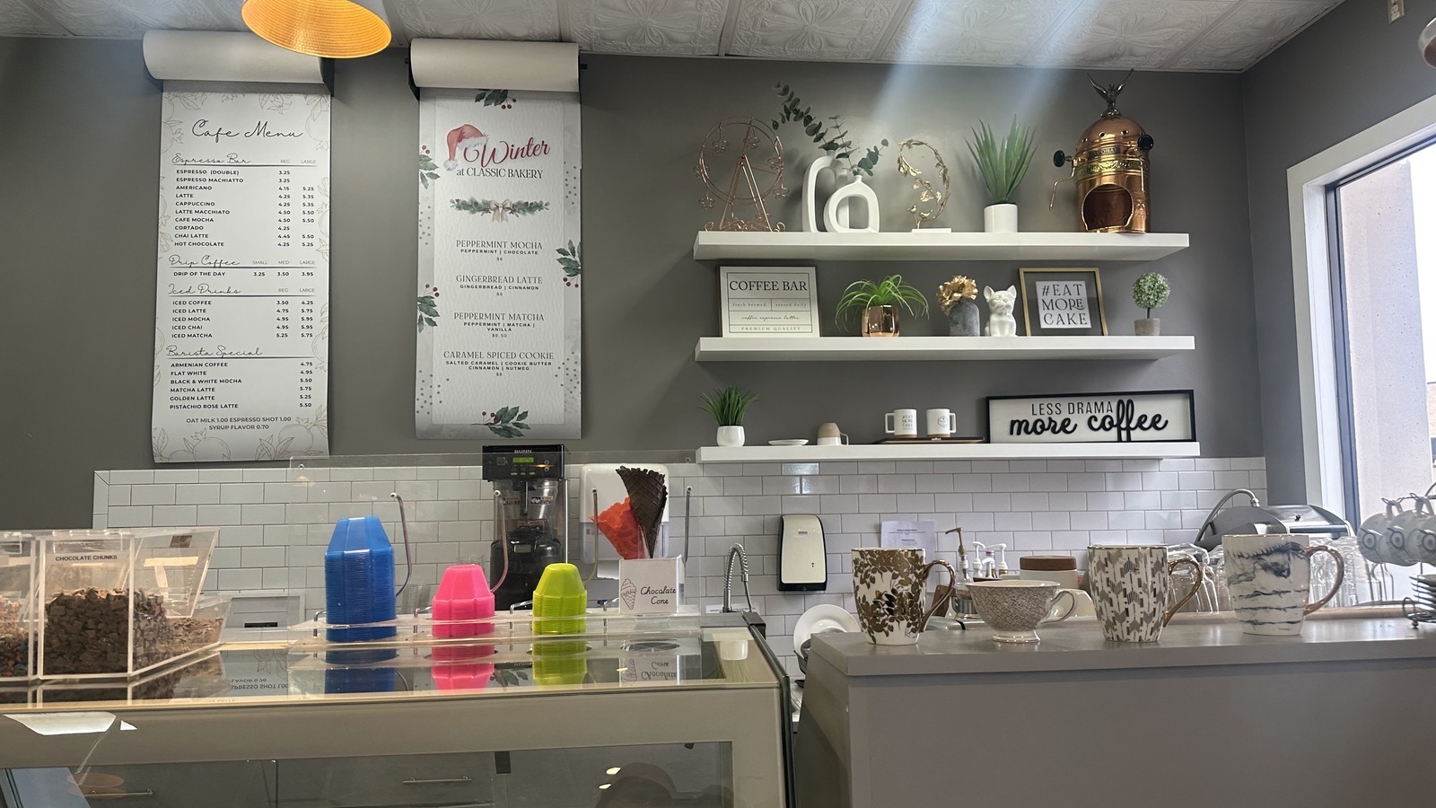 Coffee bar shelves and cafe menu inside Classic Bakery