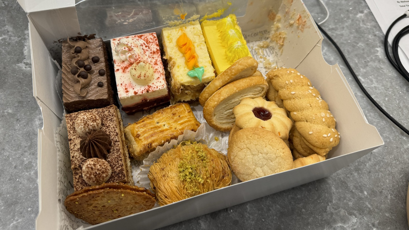 Assorted pastries and bars packed into a take-home box from Classic Bakery