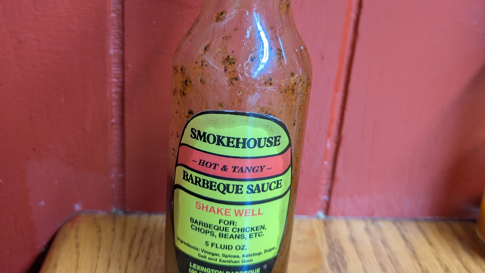 Smokehouse hot and tangy barbecue sauce bottle on a table at Lexington Barbecue