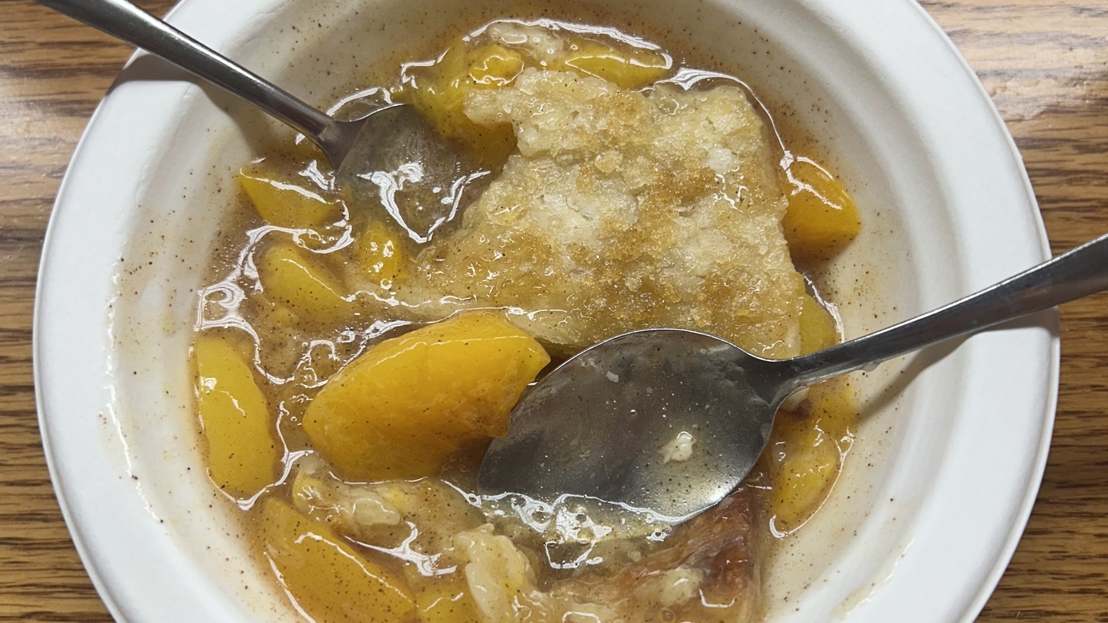 Warm peach cobbler served in a bowl at Lexington Barbecue