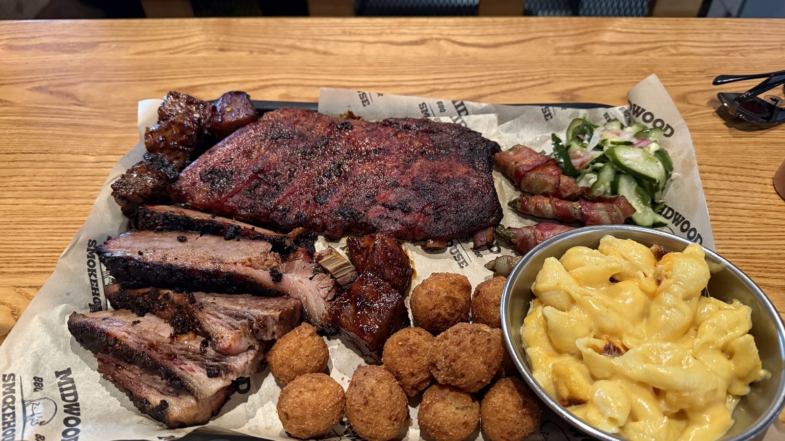 Ribs, brisket, burnt ends, mac and cheese, and hush puppies at Midwood Smokehouse.