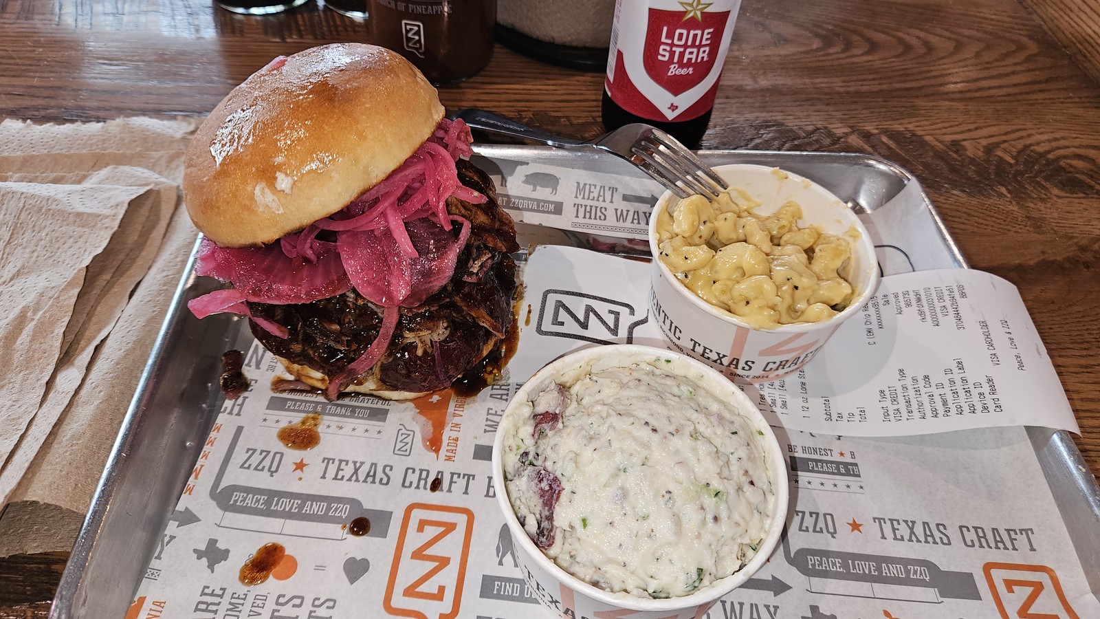 Chopped brisket sandwich with jalapeno mac and cheese and potato salad at ZZQ Texas Craft Barbeque