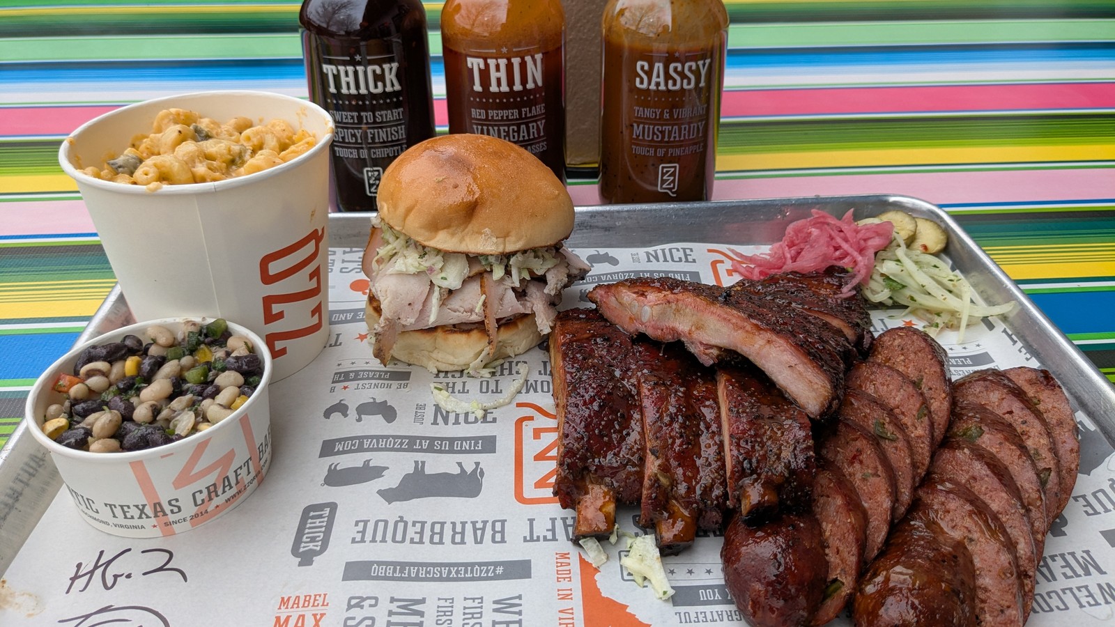 Pork ribs, sliced sausage, smoked turkey, mac and cheese, and Texas caviar on a ZZQ tray
