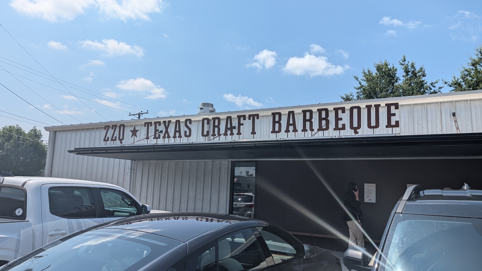 ZZQ Texas Craft Barbeque lettering stretched across the West Moore Street facade