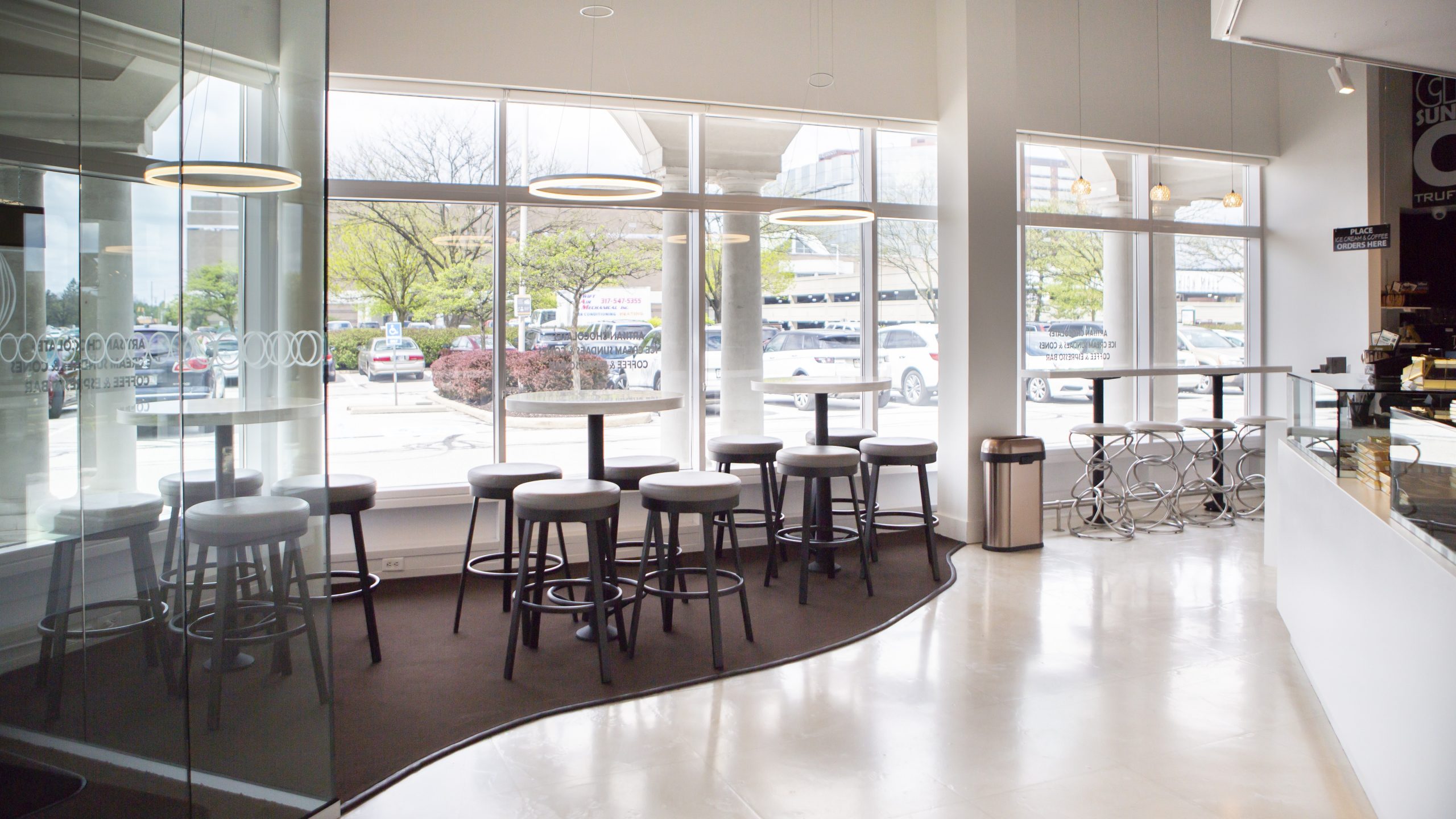 Window seating and café tables inside DeBrand Fine Chocolates in Indianapolis