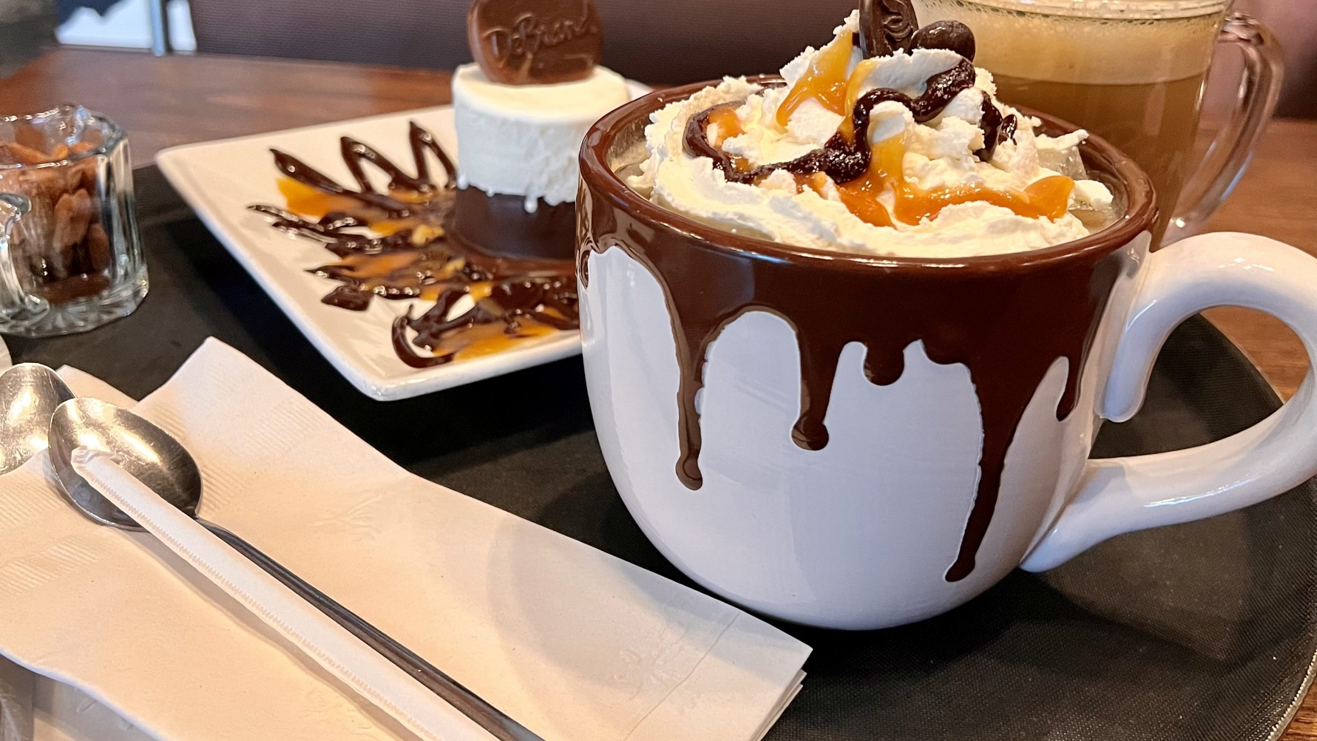 Whipped hot chocolate and plated dessert at DeBrand Fine Chocolates