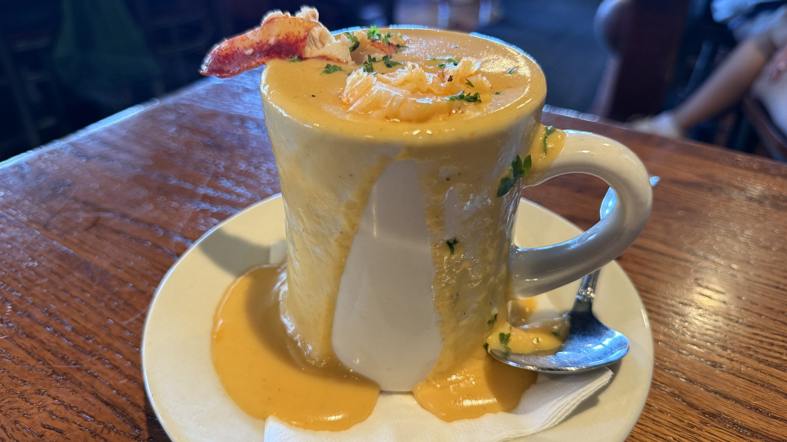 rich seafood soup served in a mug at Boston Sail Loft