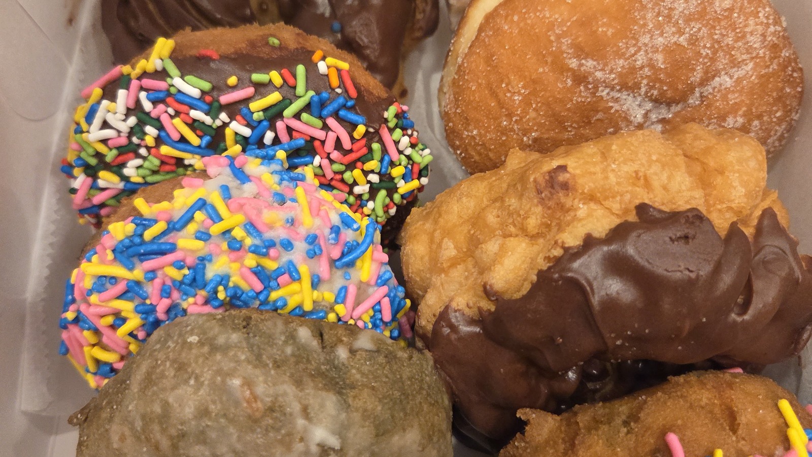 Box of chocolate doughnuts and assorted pastries from Weber's Bakery