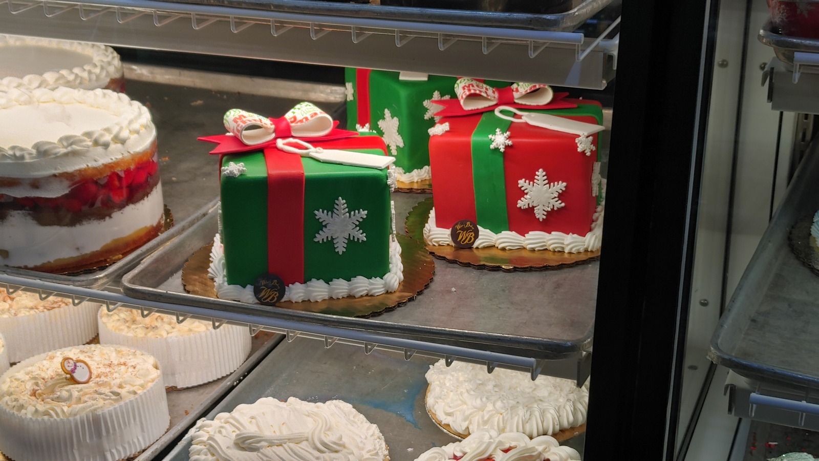 Decorated celebration cakes inside Weber's Bakery display case