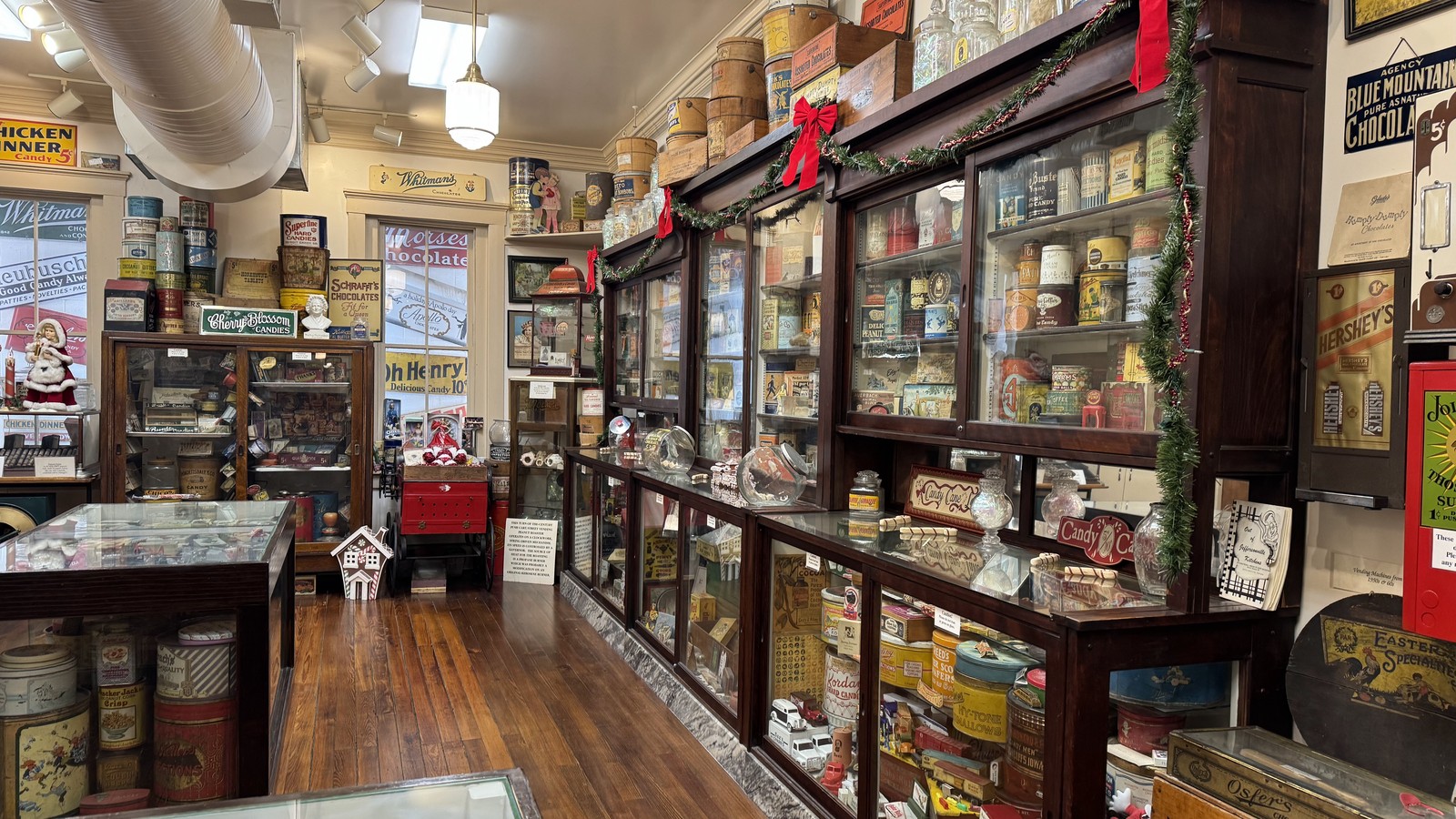 Glass candy cases and polished wood aisle inside Schimpff's Confectionery