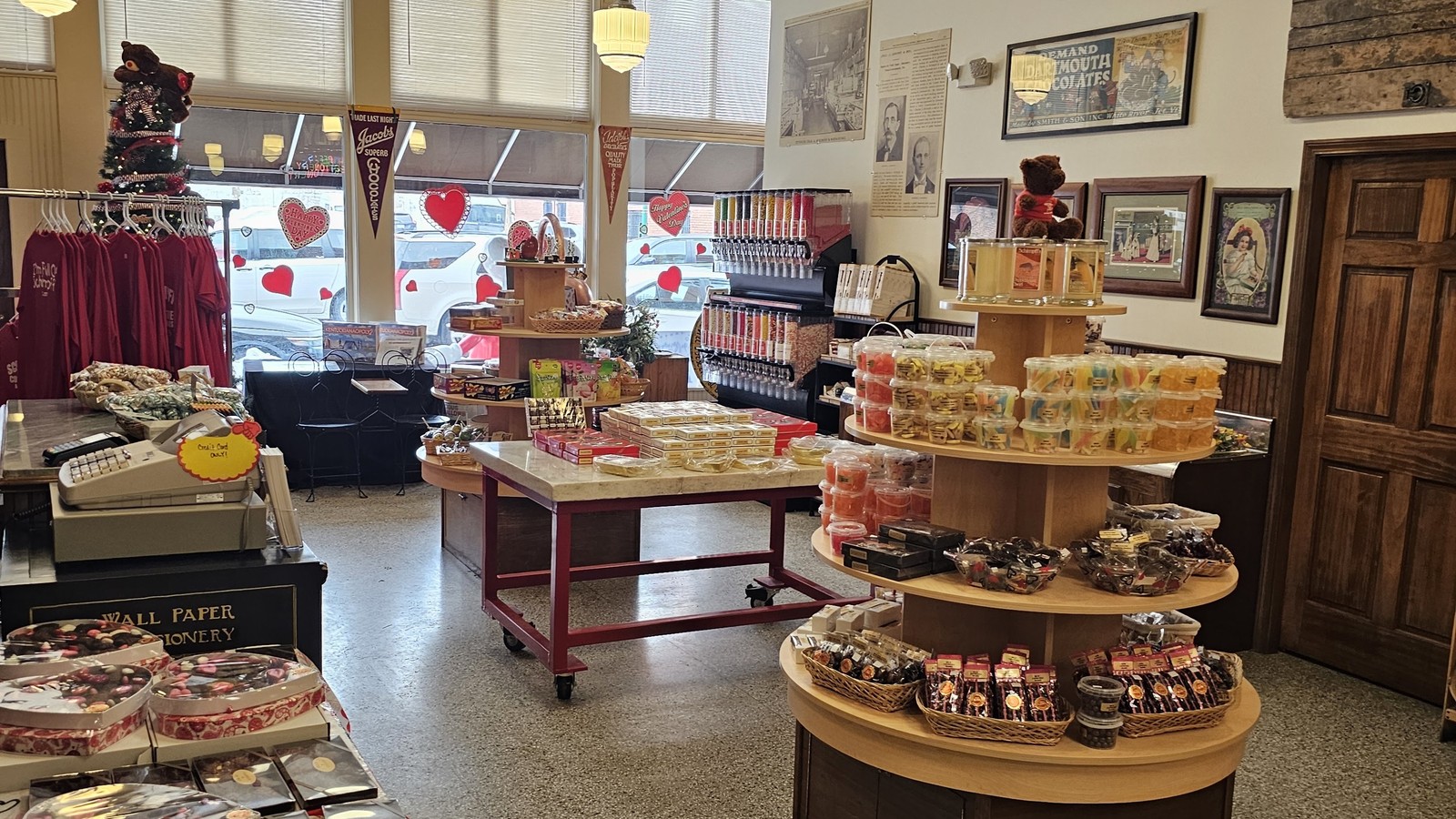Round display tables and candy shelves in the front room at Schimpff's Confectionery