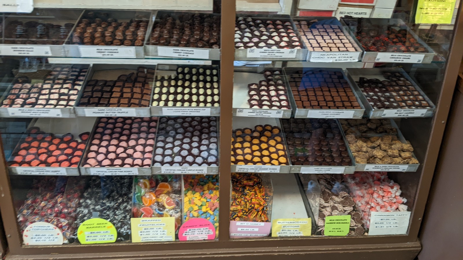 Shelves of chocolates, caramels, and hard candy inside Schimpff's Confectionery
