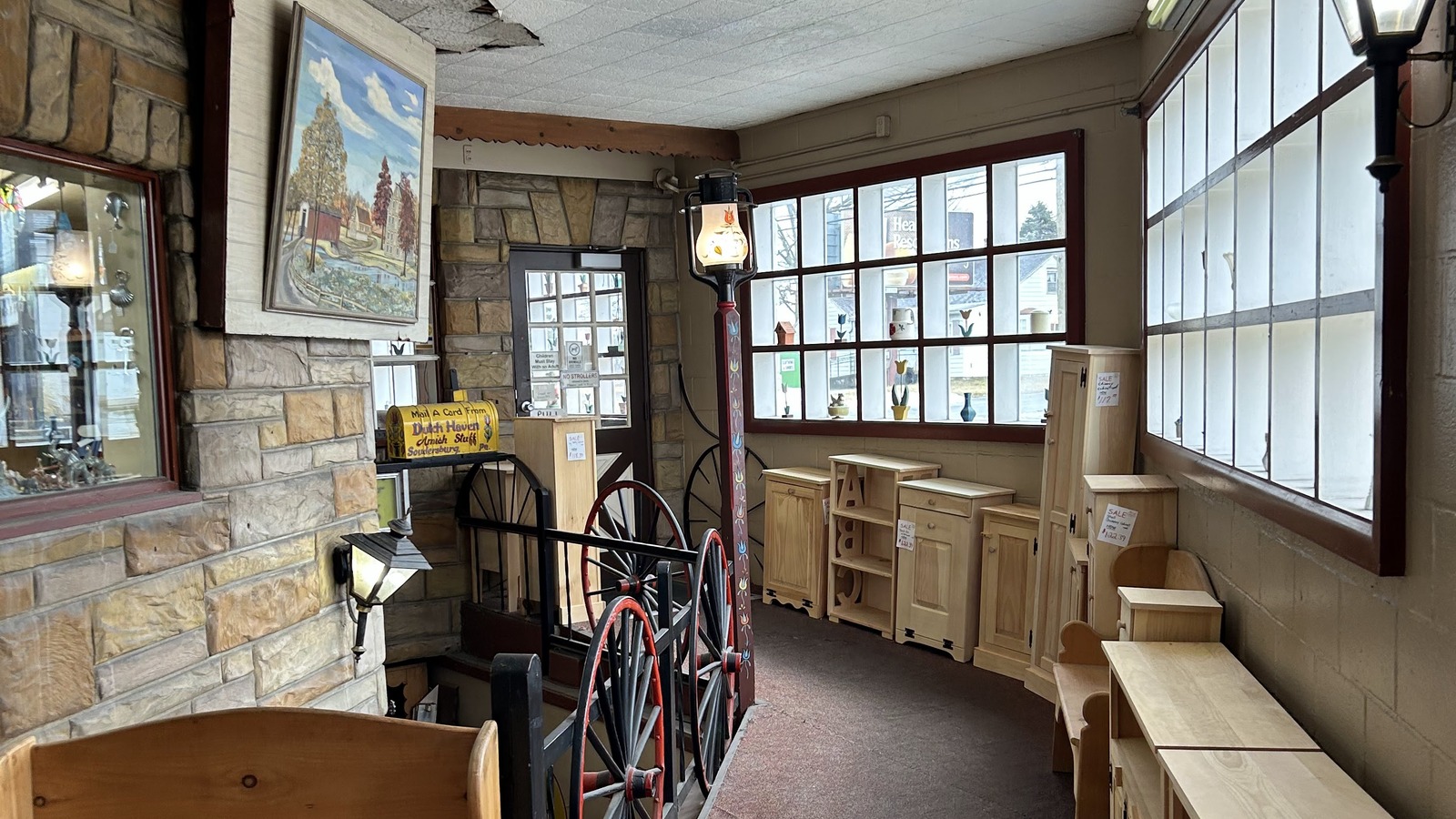 Hallway at Dutch Haven with wagon details, pine furniture, and large windows.