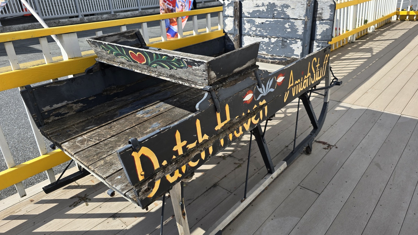 Hand-painted Dutch Haven bench on the front porch.