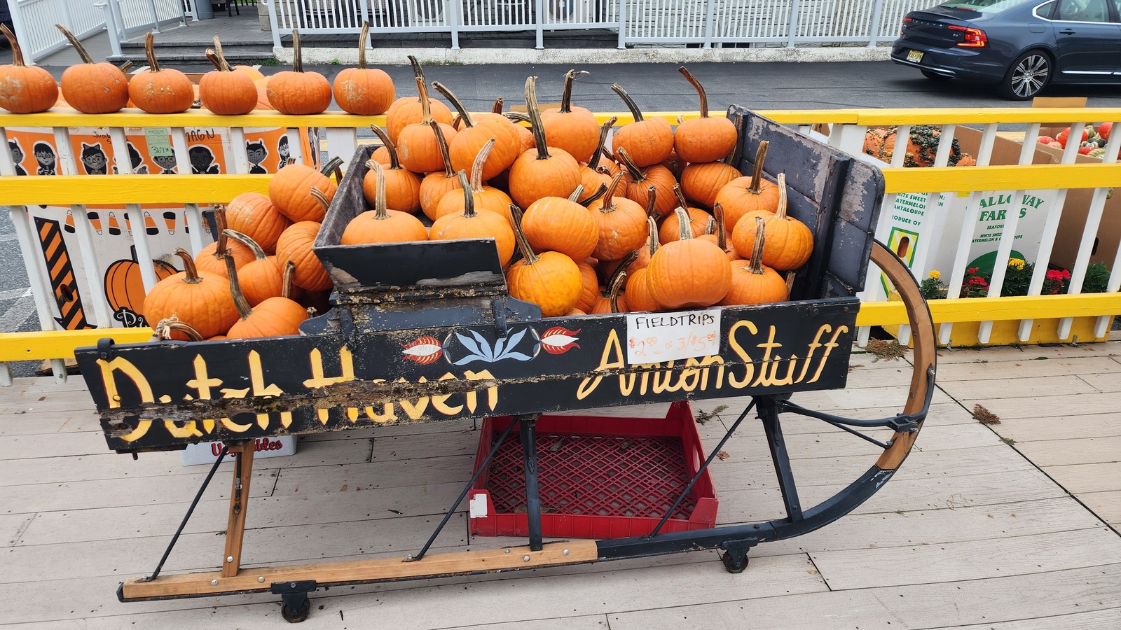 Pumpkin-filled wagon outside Dutch Haven in harvest season.