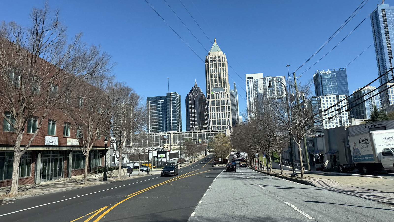 Midtown Atlanta skyline rising above the 14th Street approach to Silver Skillet