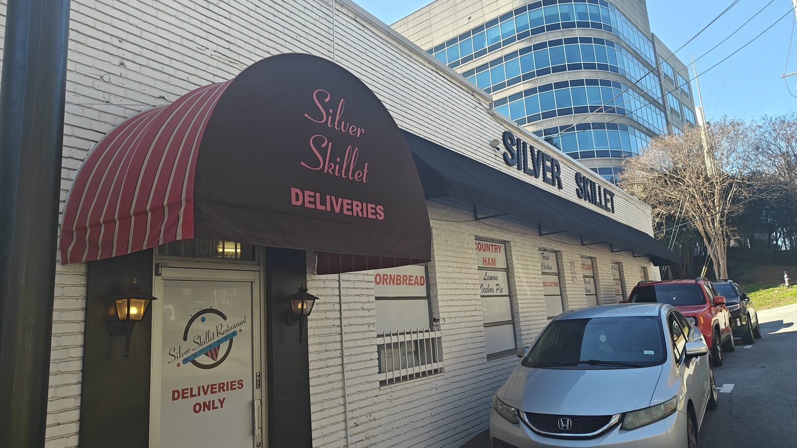Red awning and side entrance at Silver Skillet beside the Midtown streetfront