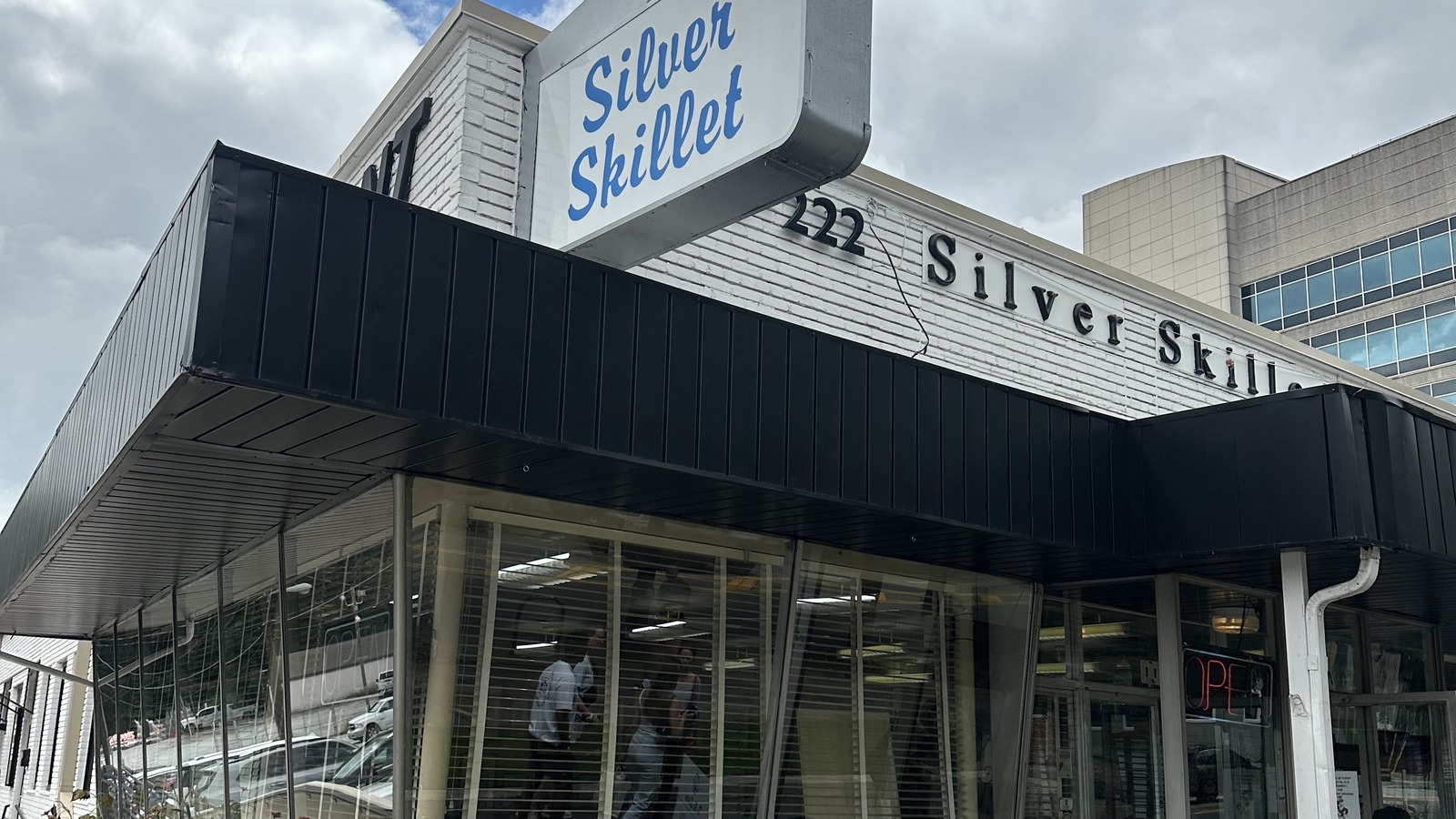 Silver Skillet corner sign, dark awning, and front windows facing 14th Street