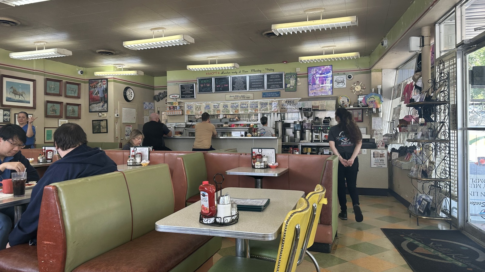 Front booths, checkerboard floor, and open counter area inside Silver Skillet