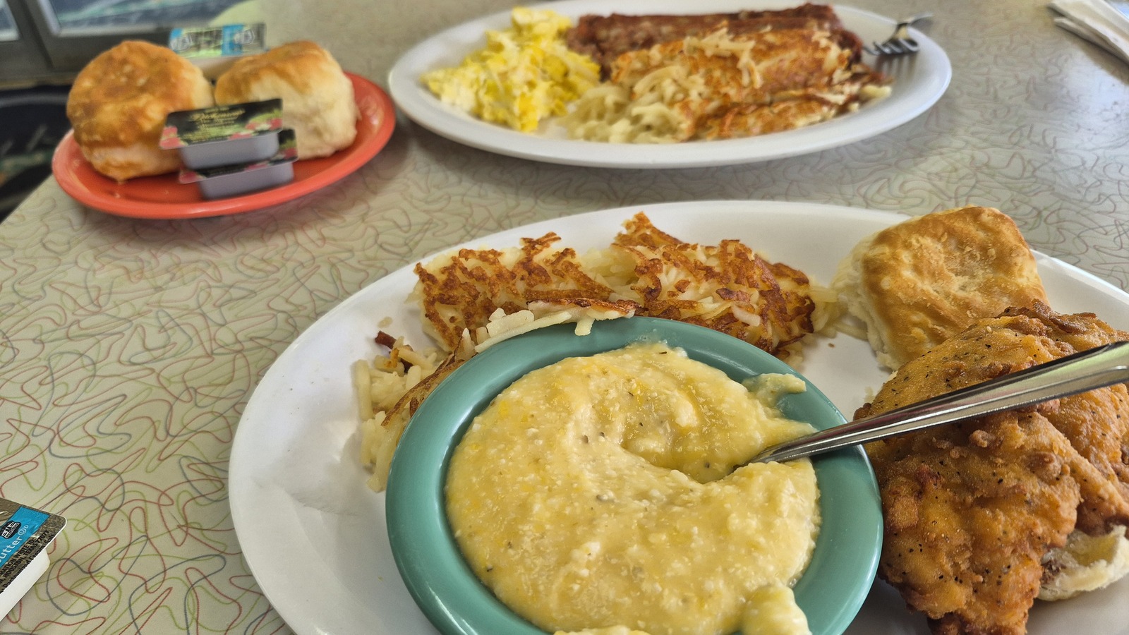 Fried catfish breakfast with creamy grits, eggs, hashbrowns, and a biscuit at Silver Skillet