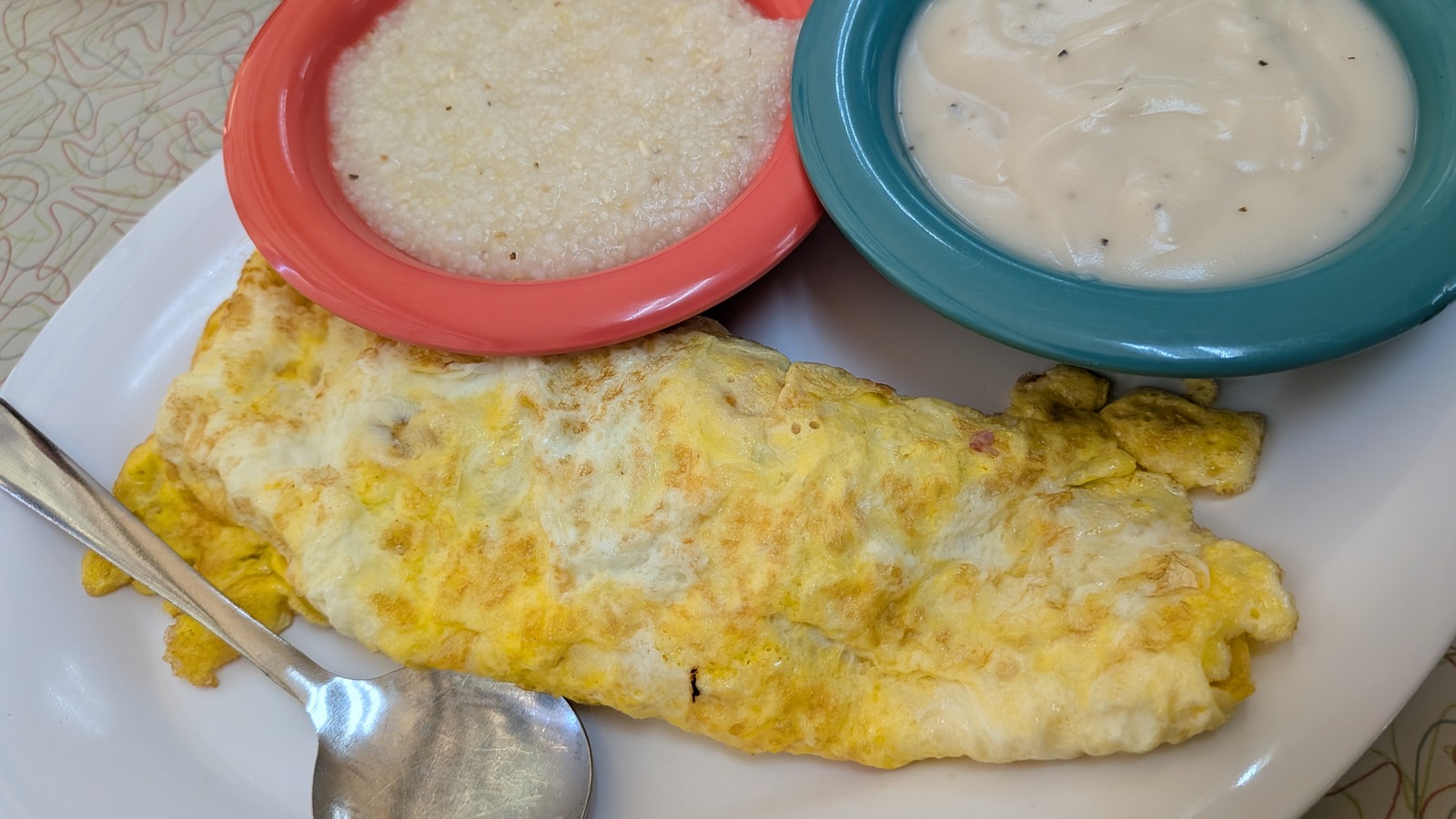 Large omelet with grits, biscuit, and cream gravy at Silver Skillet
