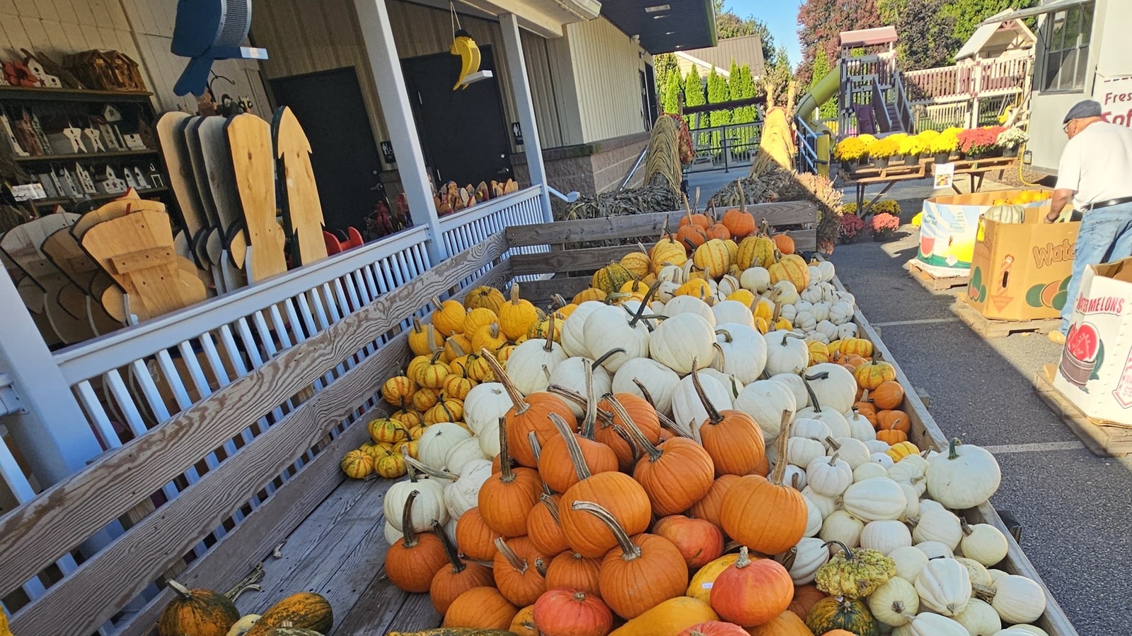 Seasonal gourds and porch market display at Bird-in-Hand Bake Shop