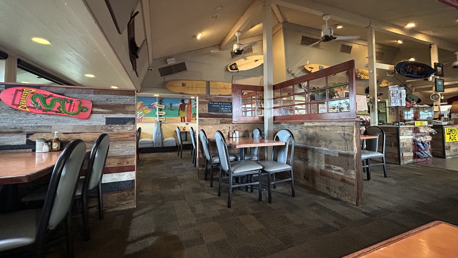 Surf-themed dining room with booth seating inside Original Breakfast House