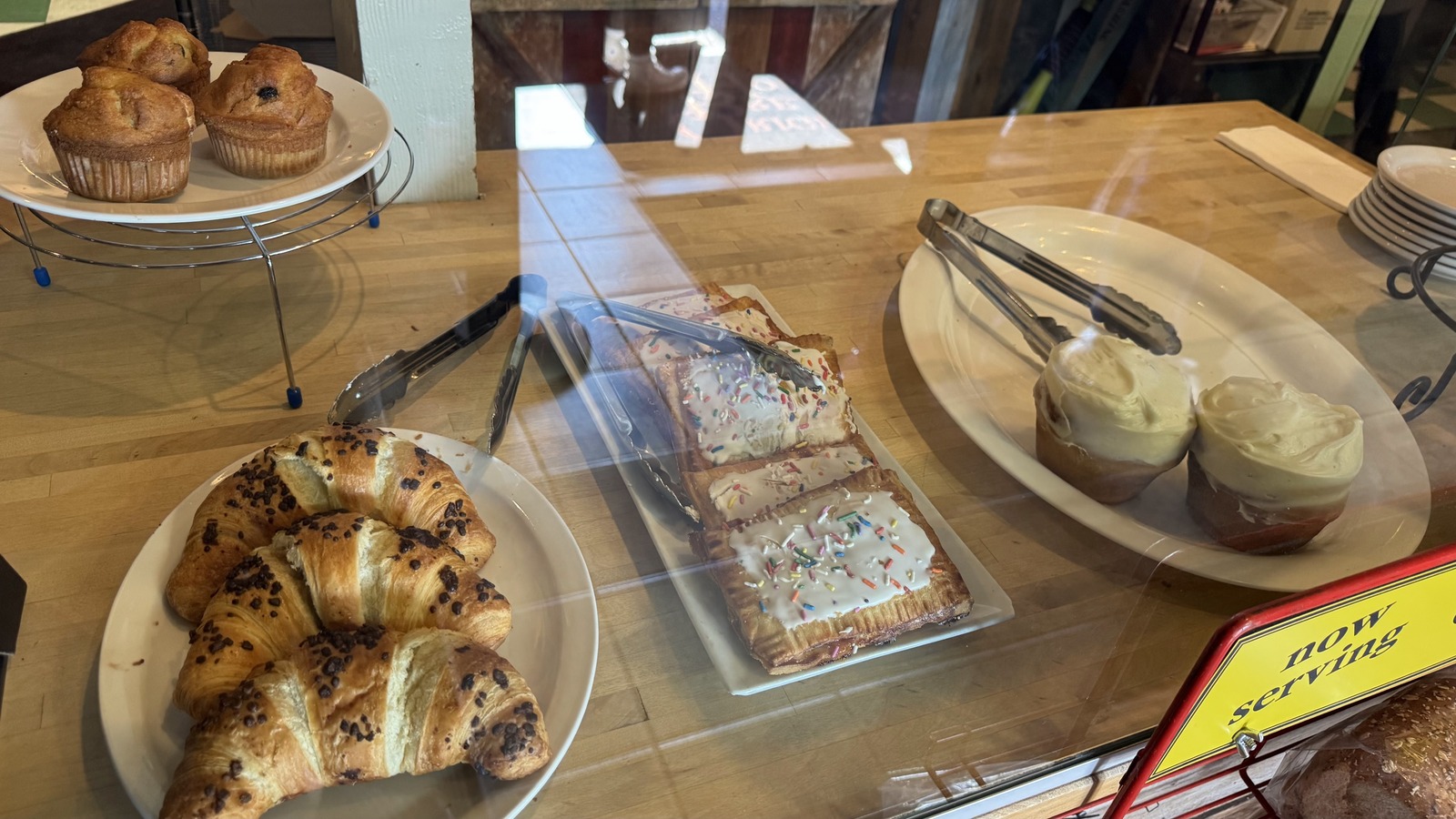 Pastry case with croissants, toaster pastries, muffins, and cinnamon rolls at Original Breakfast House