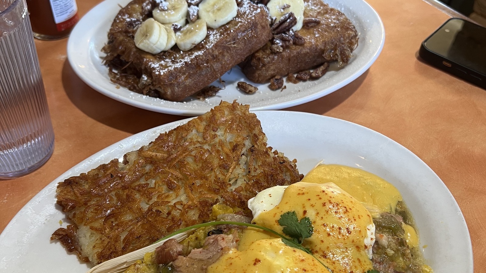 Loaded Benedict with crisp hash browns and banana-topped French toast at Original Breakfast House