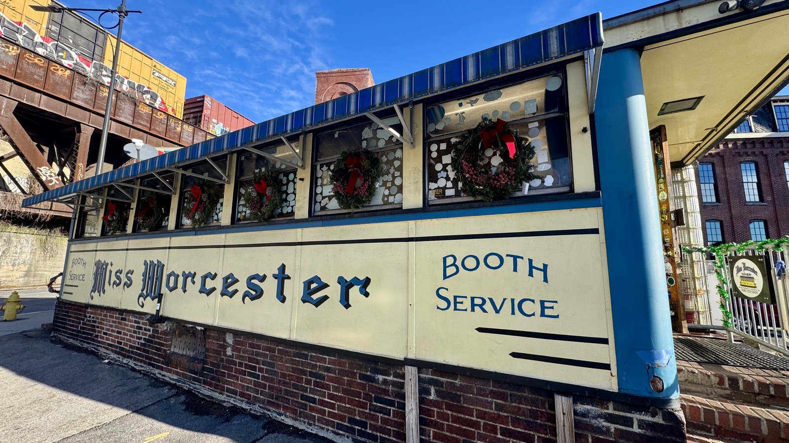 Side wall of Miss Worcester Diner beneath the elevated rail line in Worcester