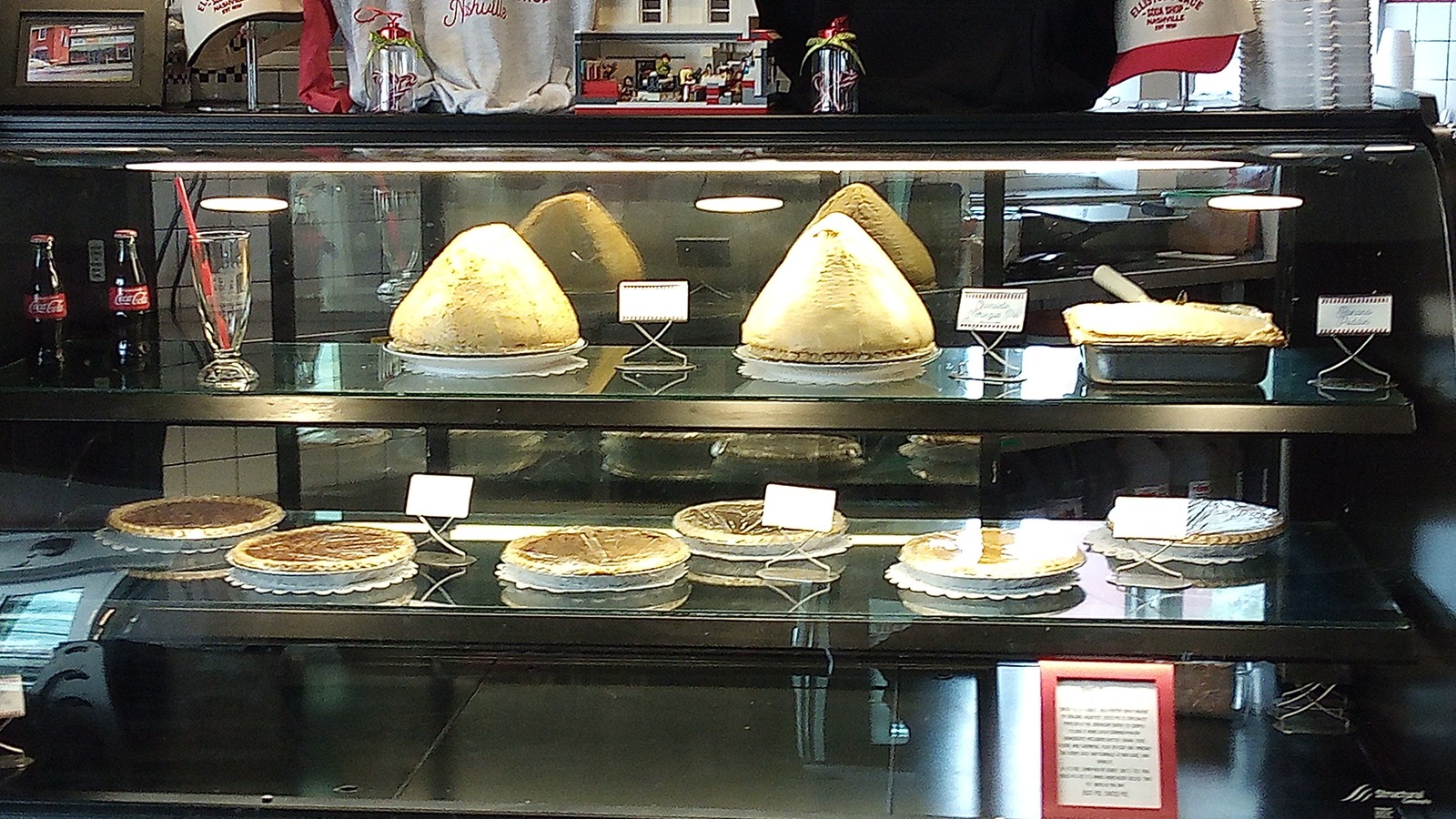 Glass dessert case filled with house pies at Elliston Place Soda Shop