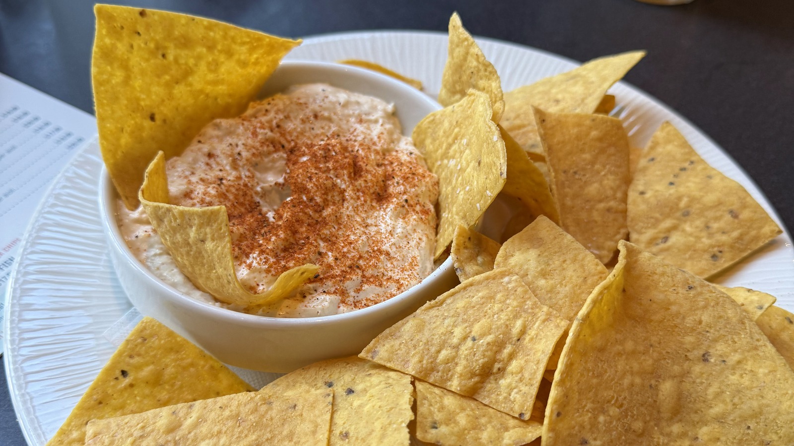Creamy crab dip surrounded by tortilla chips at Waterman's Surfside Grille