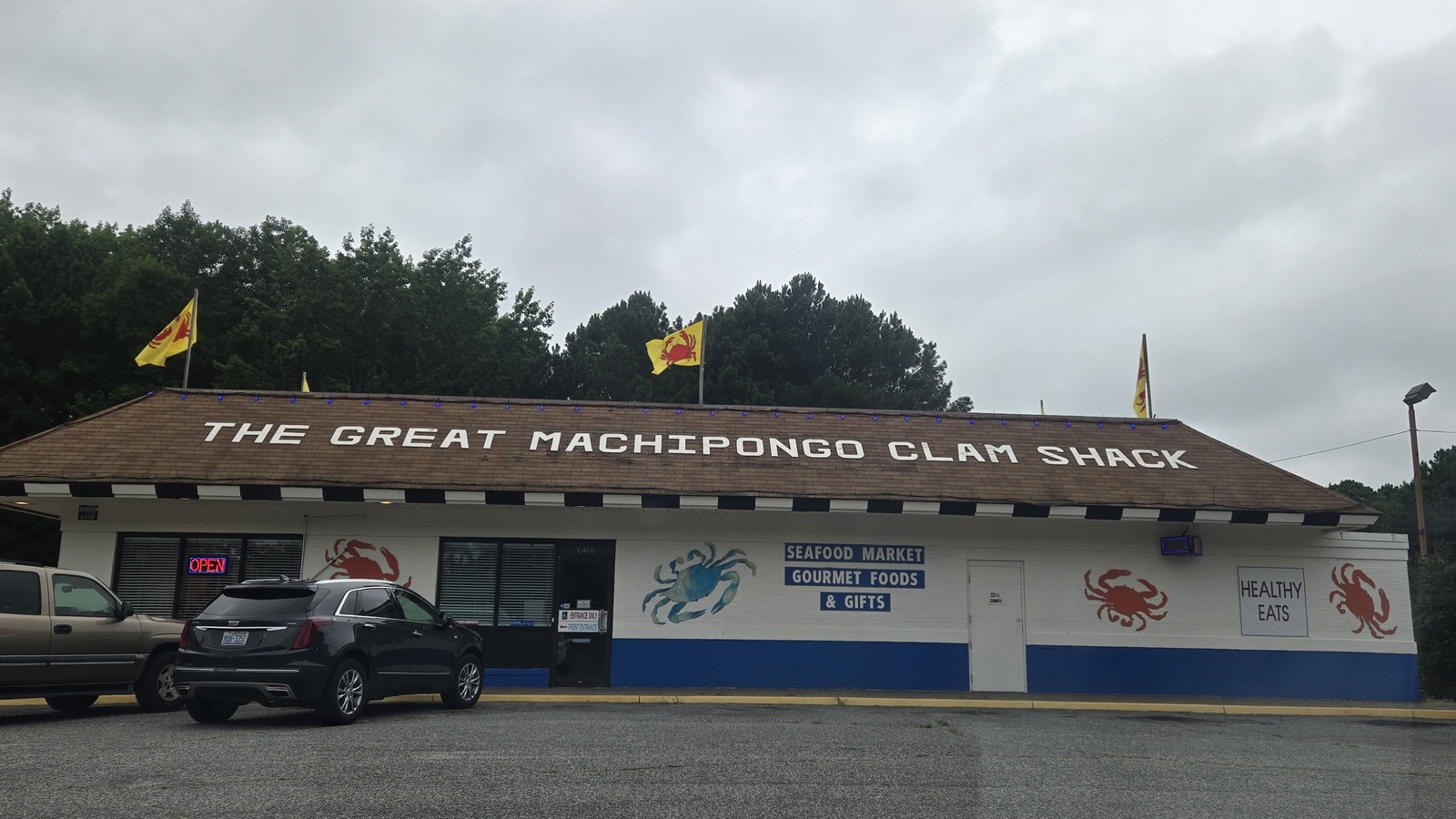 The Great Machipongo Clam Shack roofline with crab-painted exterior panels and market signage
