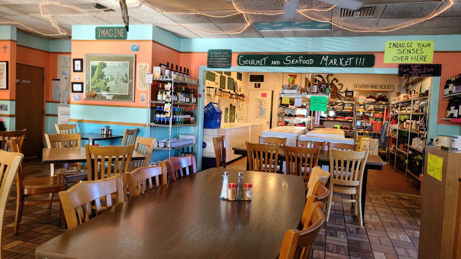 Dining room tables facing the gourmet and seafood market inside The Great Machipongo Clam Shack