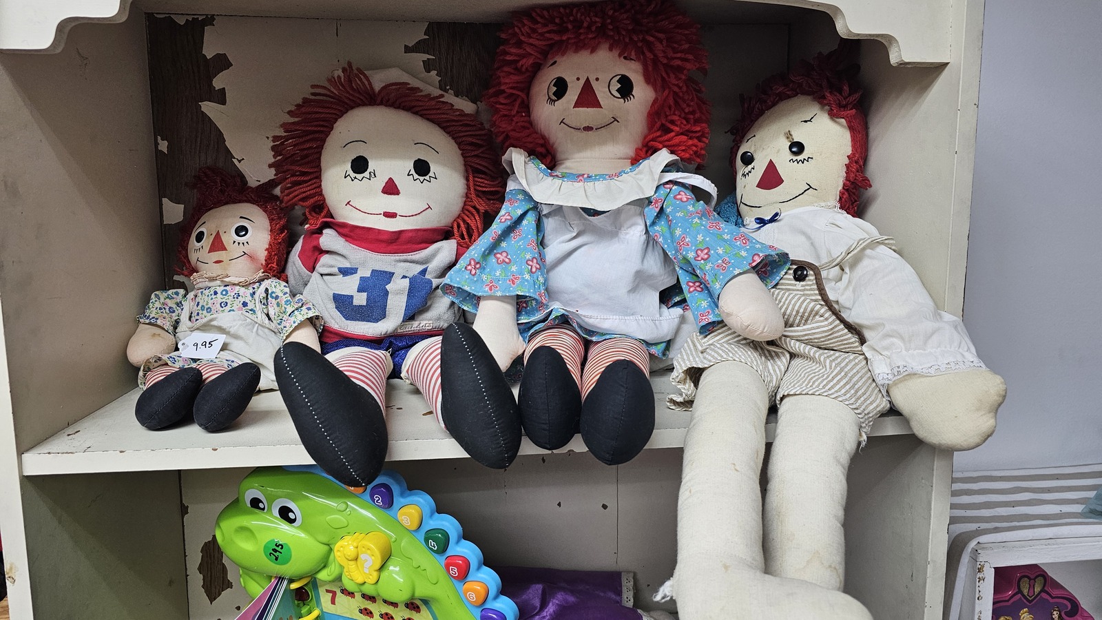 Vintage dolls, books, and toy finds at Junk-Atique Outlet Thrift Store in Bakersfield