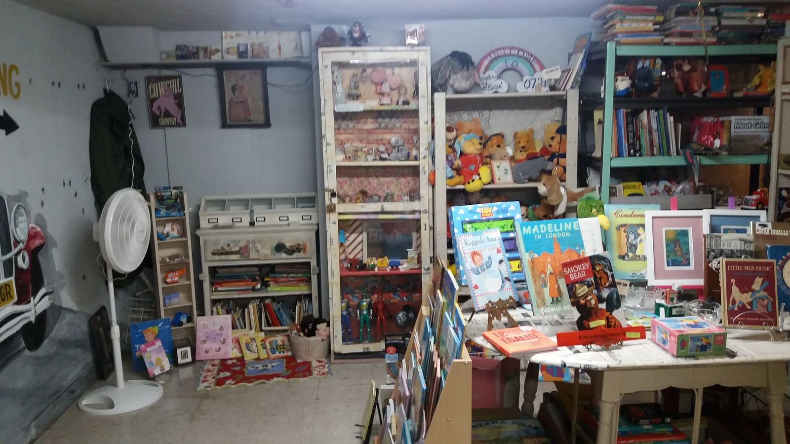 Toys, books, and small vintage finds inside Merry Go Round Antique Mall in Bakersfield