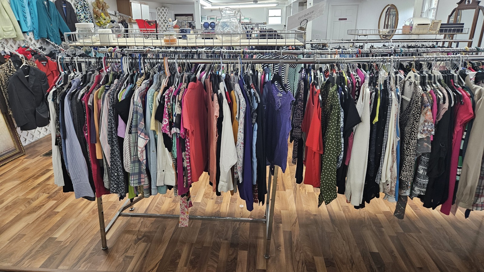 Long clothing racks inside God's Corner in Johnson City