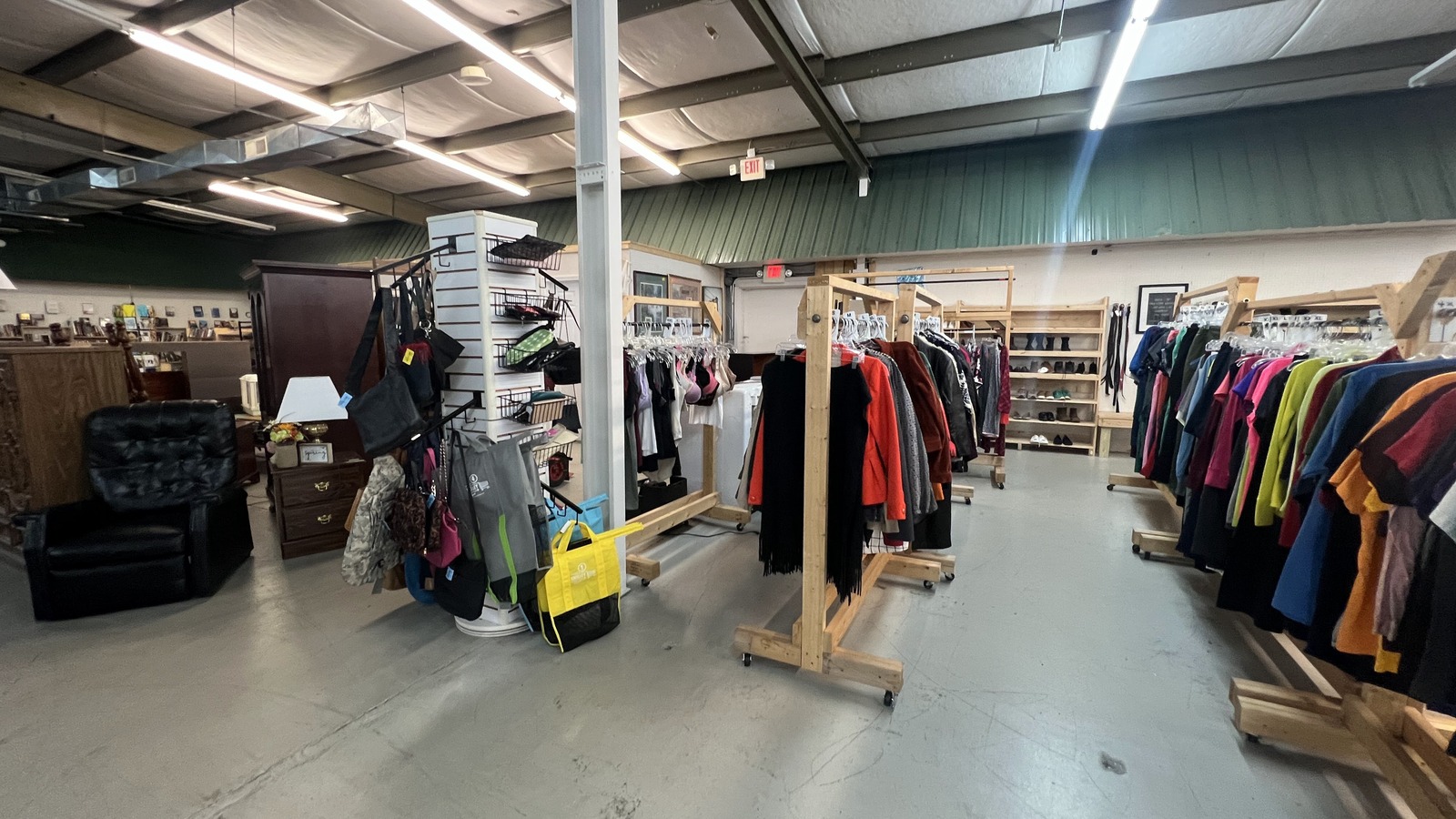 Clothing racks and open shopping floor at Wags to Riches Thrift Store in Johnson City