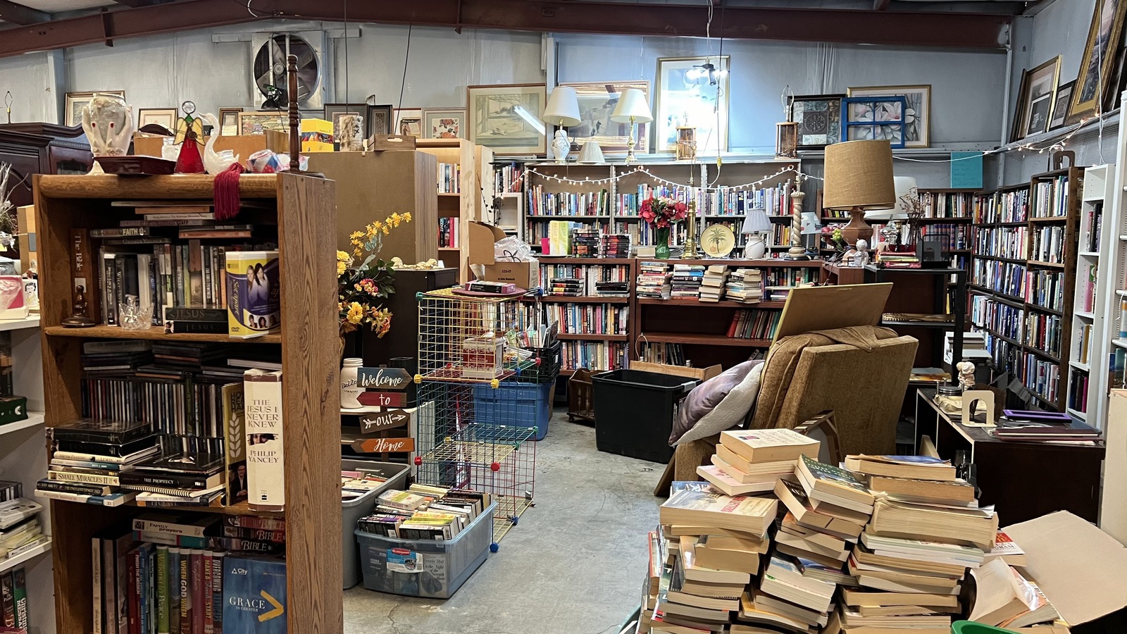 Book-lined room with stacked shelves inside Thrift Shop at Boones Creek in Johnson City