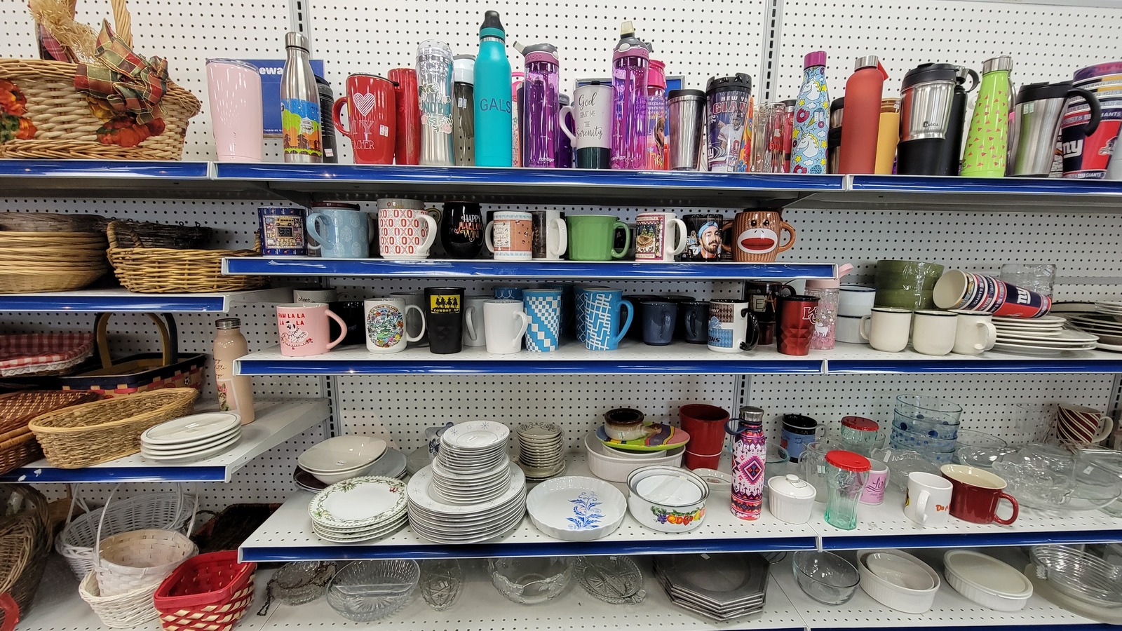 Shelves of mugs, dishes, and housewares inside the Lynnhaven Road Goodwill in Virginia Beach