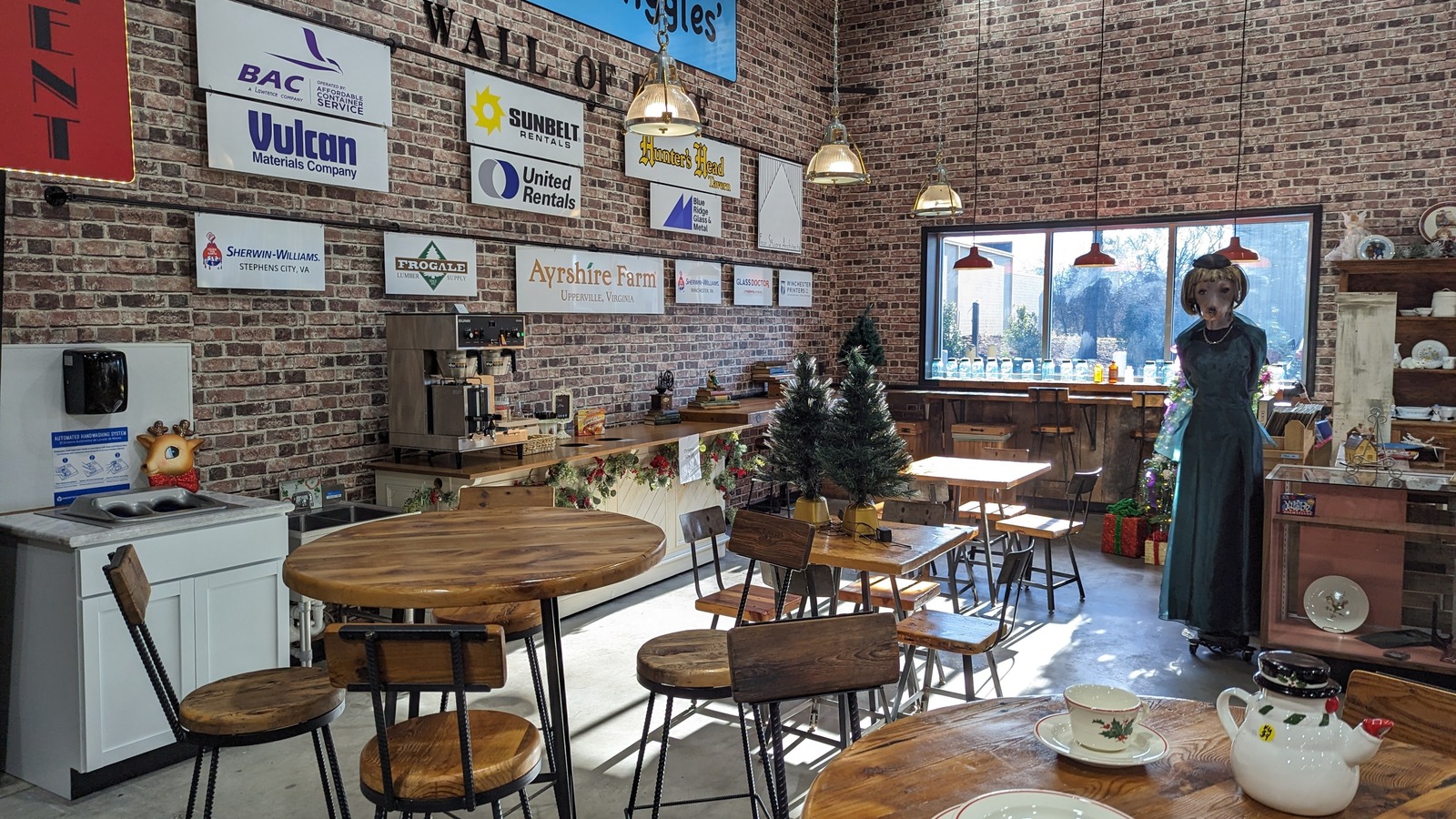 Tables, vintage decor, and open floor space inside WASPCA Thrift Shop in Winchester