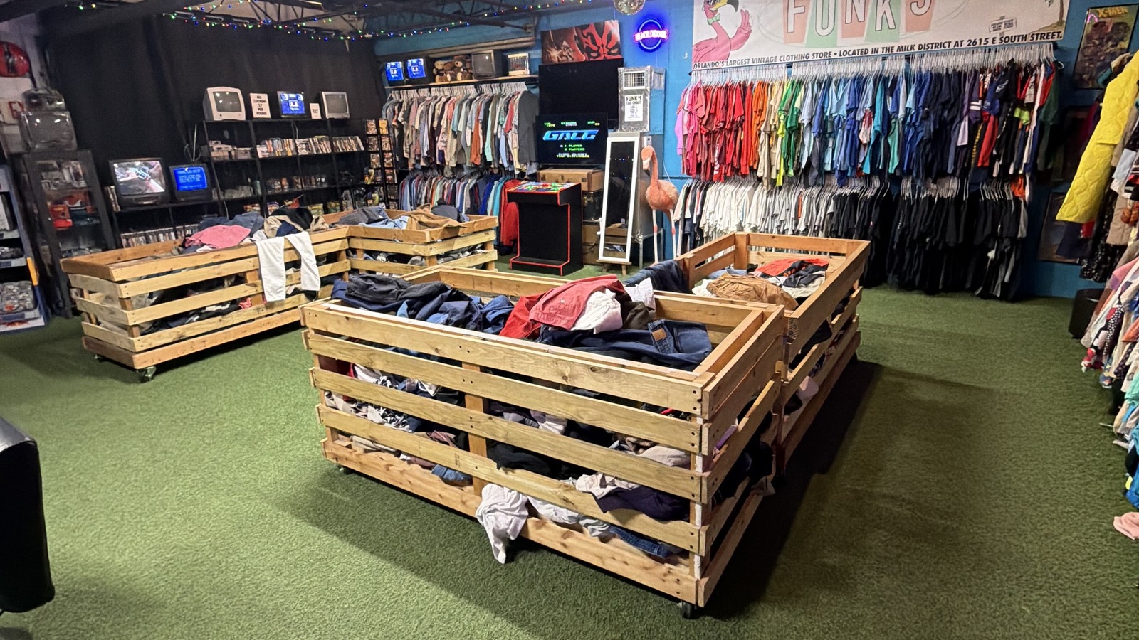 Open central floor with vintage bins and racks inside Funk's Vintage Clothing in Orlando