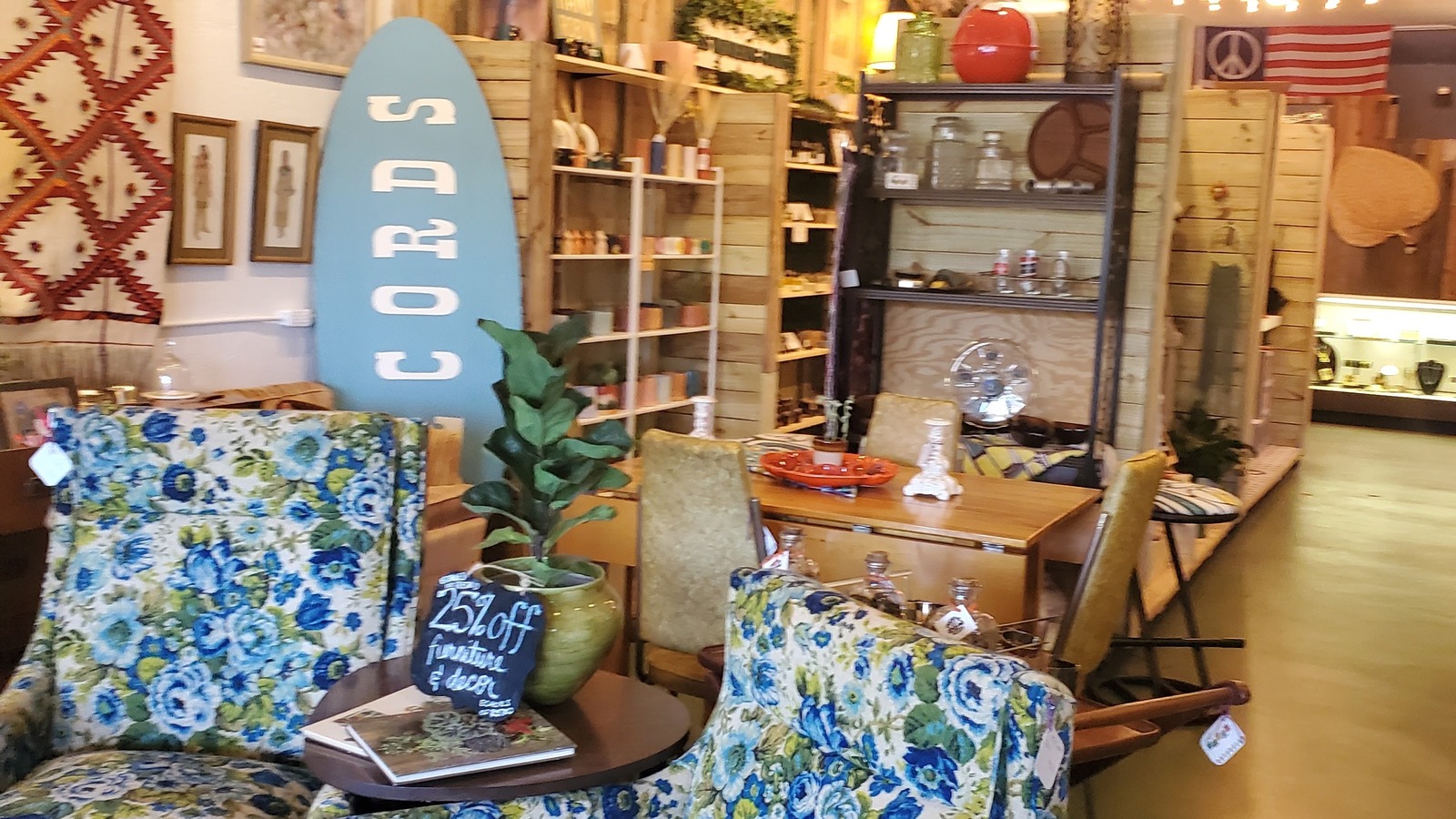 Curated shelves, pillows, and vintage decor inside The Owl's Attic in Orlando