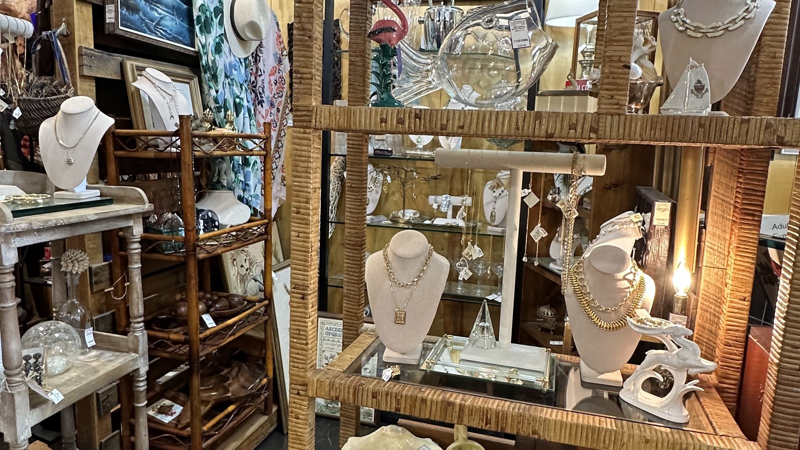 Jewelry displays and vintage shelves inside The Lovely Vintage Market in Orlando