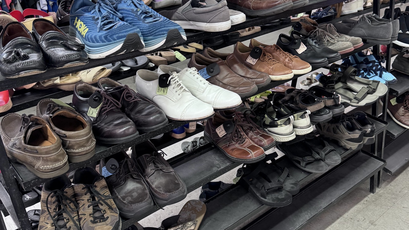 Packed shoe shelves inside Community Thrift Store near Orlando