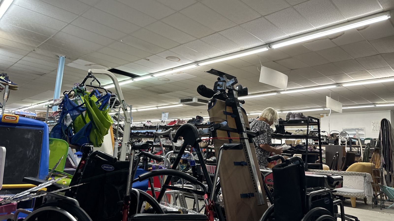 Rows of bikes and larger gear inside Community Thrift Store