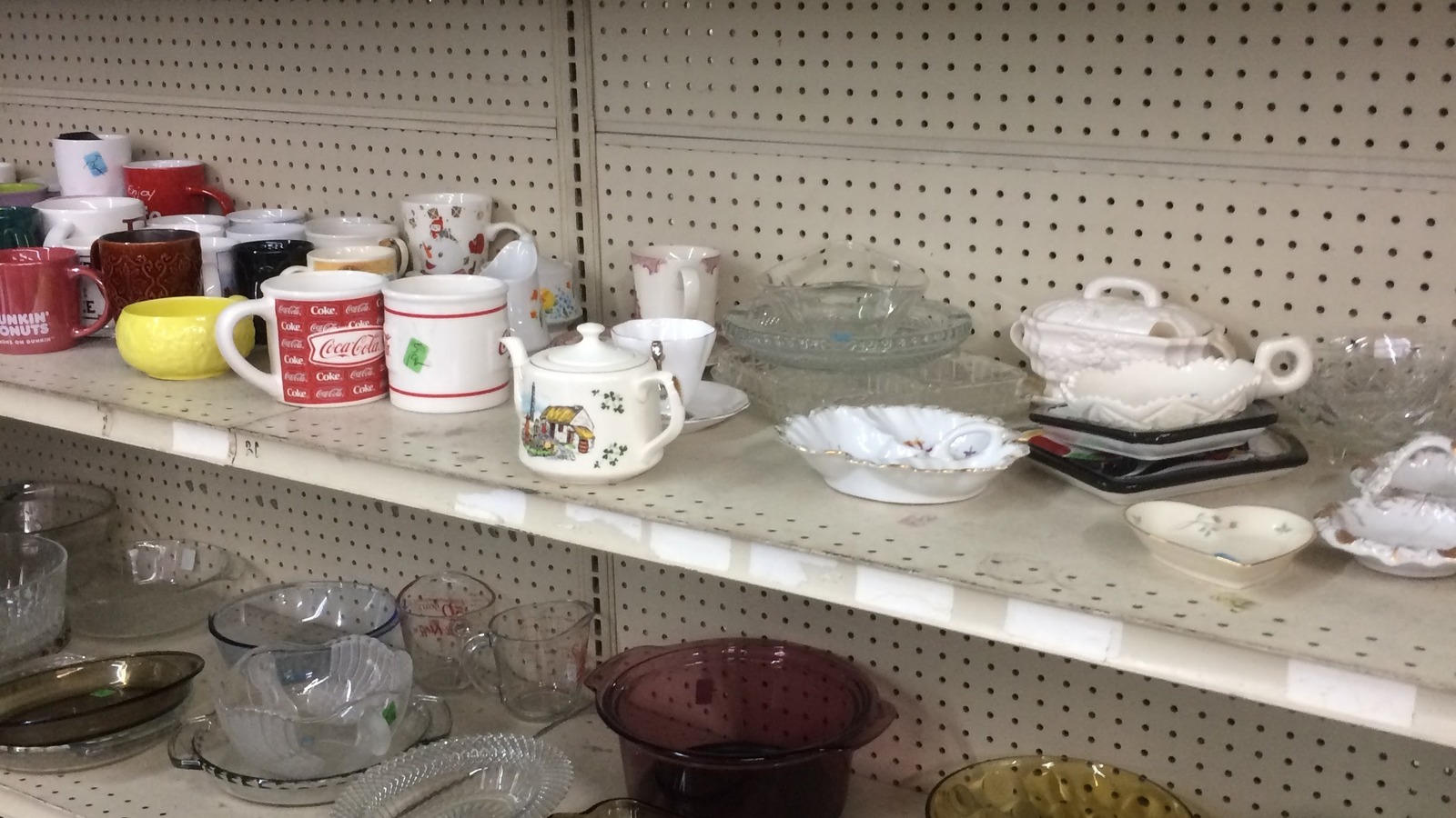 Teacups and small serving pieces inside Community Thrift Store