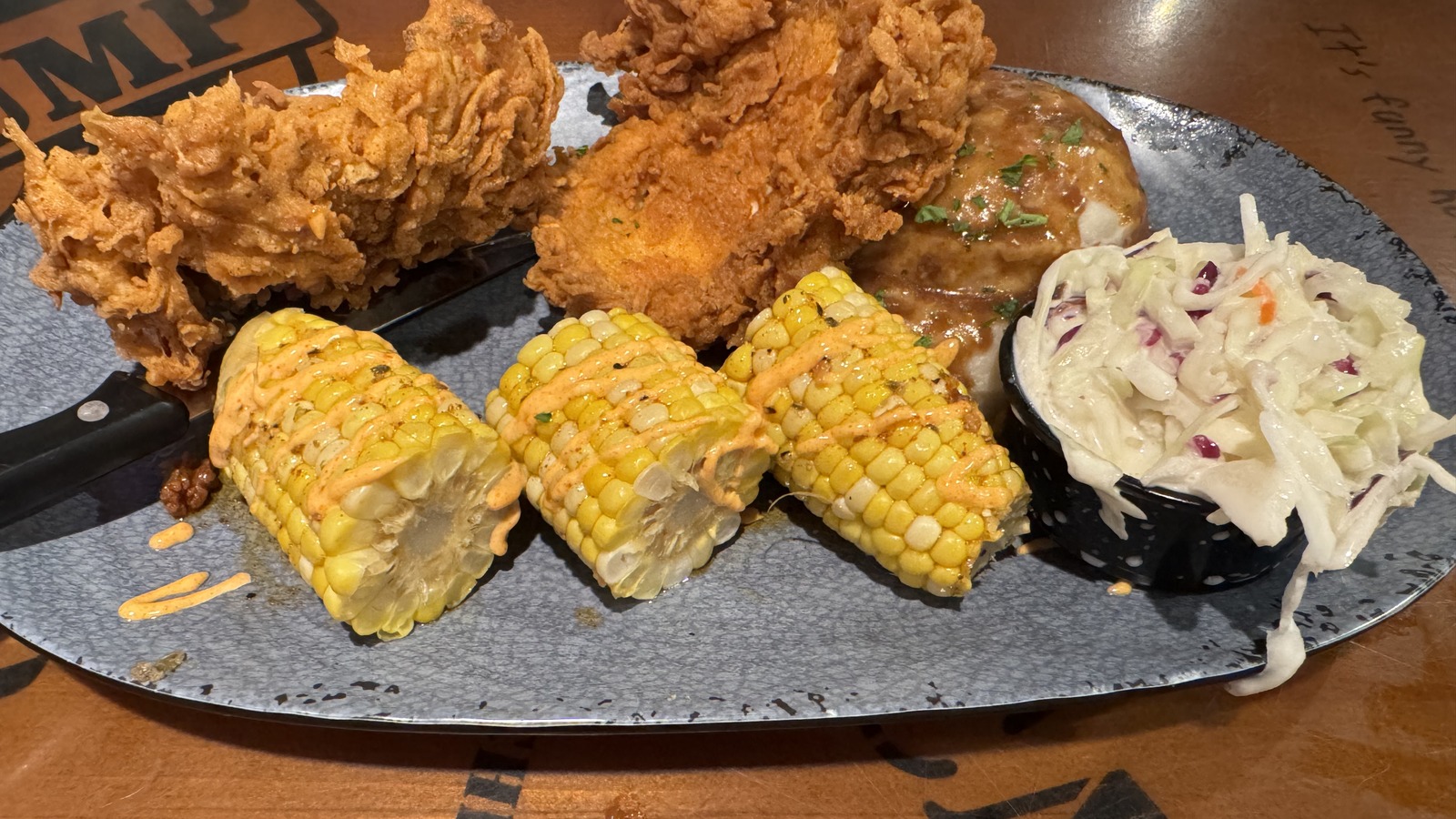 Fried chicken, corn on the cob, and coleslaw platter at Bubba Gump Shrimp Co. Orlando