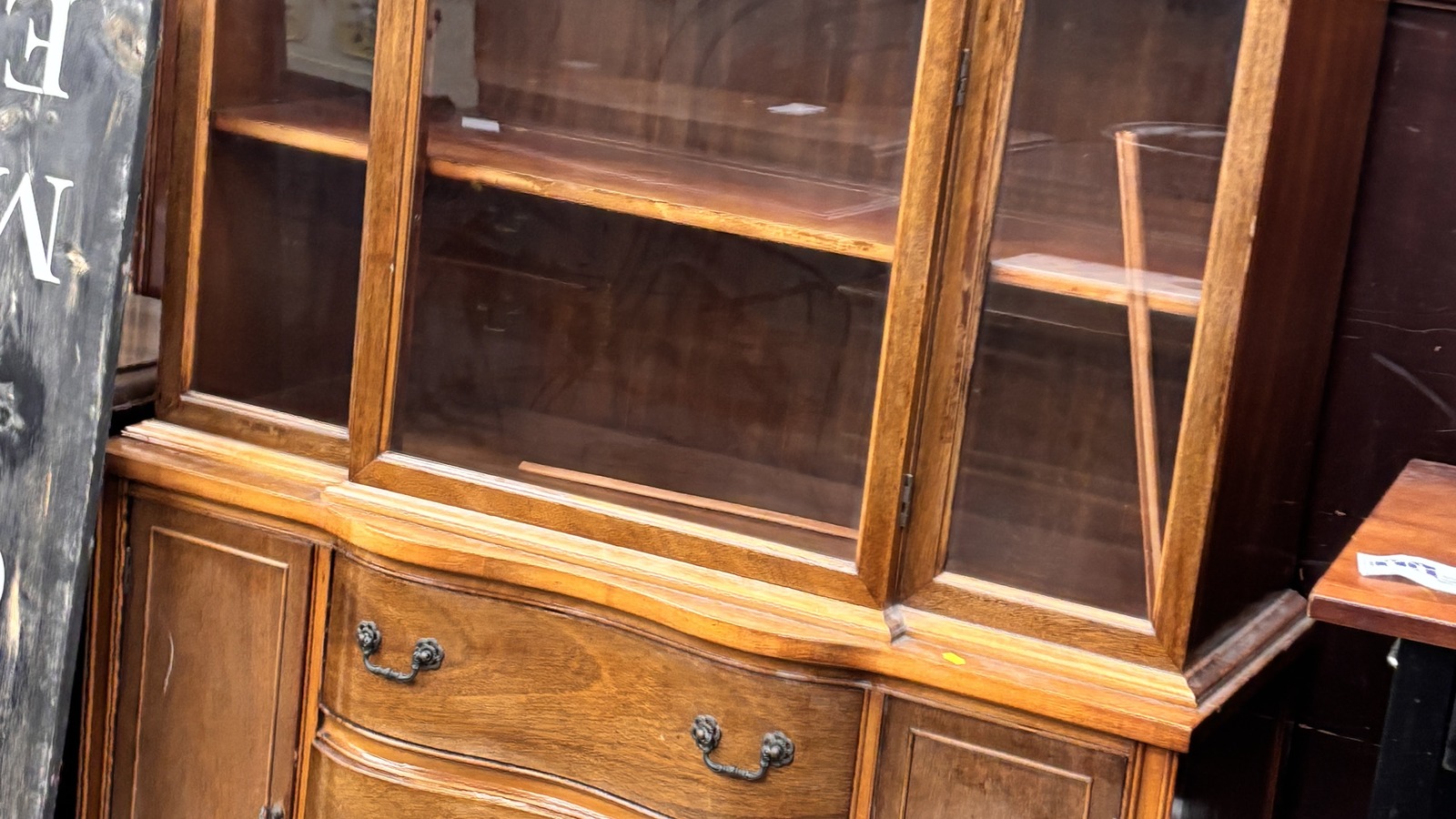 Wooden hutch and furniture pieces inside St. Vincent de Paul Thrift Store and Donation Center in Cincinnati