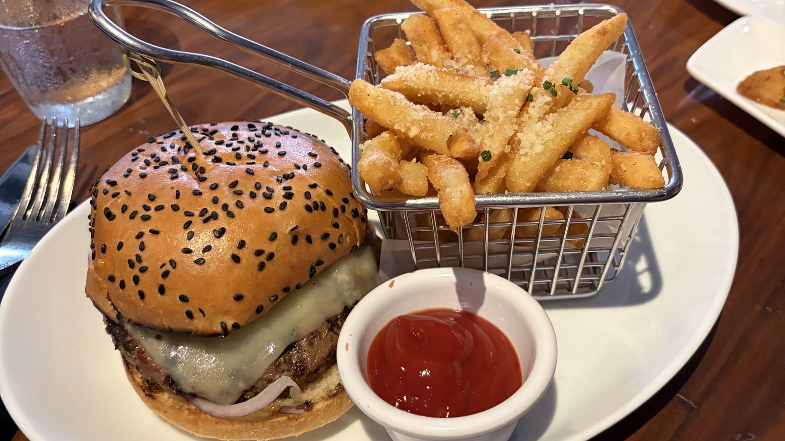 STK lunch spread in Orlando with burger, fries, and rich macaroni and cheese